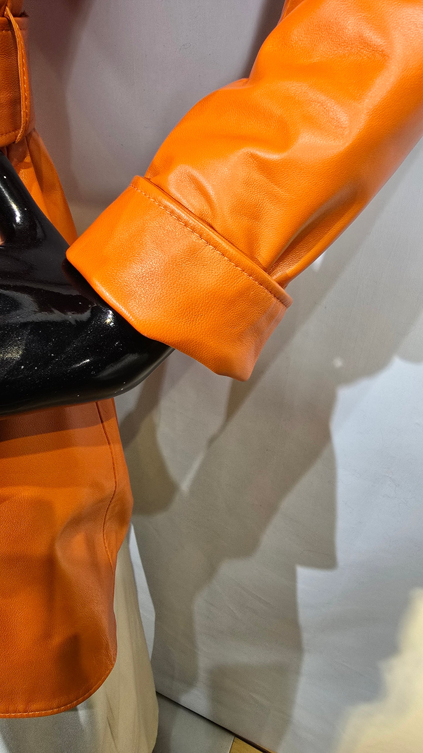 Ladies beautiful orange lambskin leather DB Trench Coat. Amazing quality with wide collar, oversized buttons & cuff sleeves.