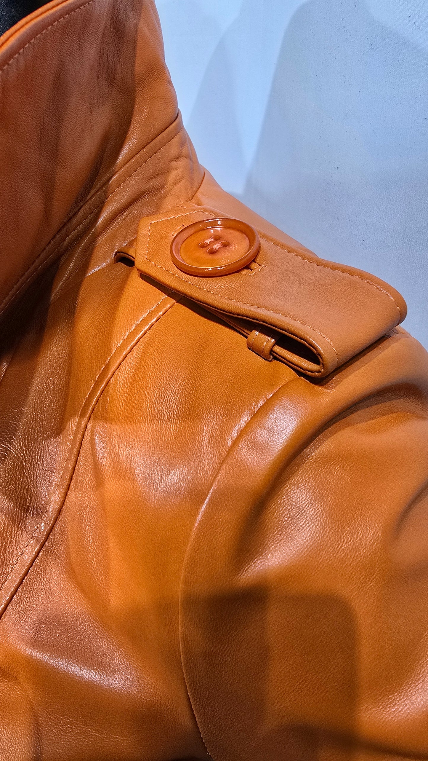 Ladies beautiful orange lambskin leather DB Trench Coat. Amazing quality with wide collar, oversized buttons & cuff sleeves.