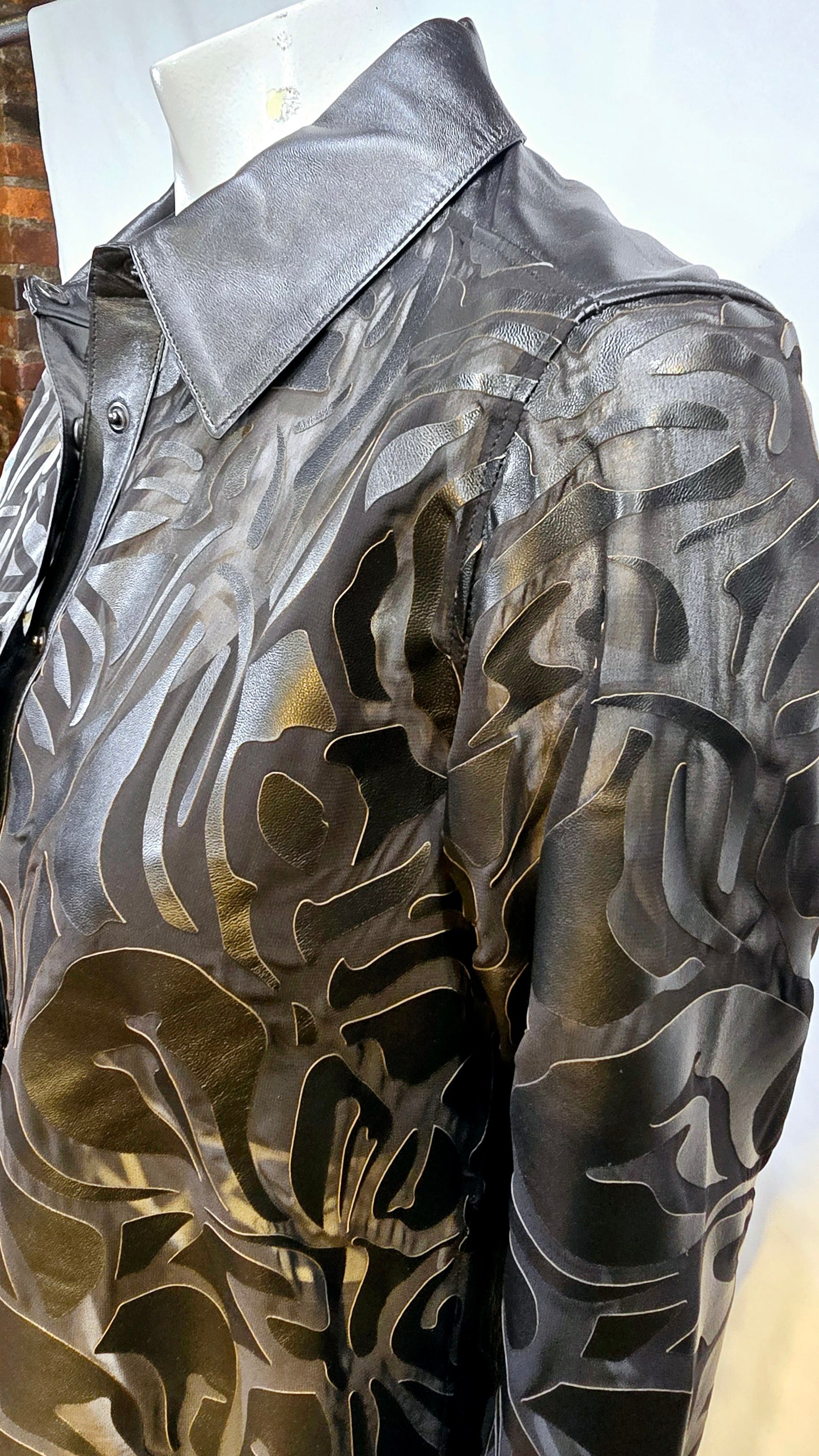 Amazing quality burnt out design lambskin leather blouse with snap button.
