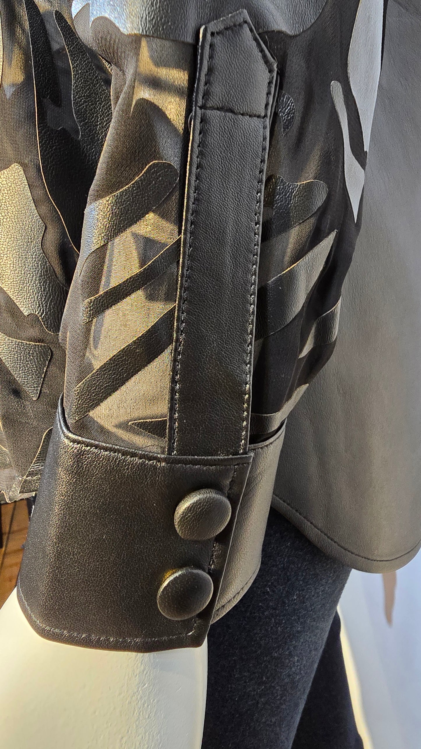 Amazing quality burnt out design lambskin leather blouse with snap button.