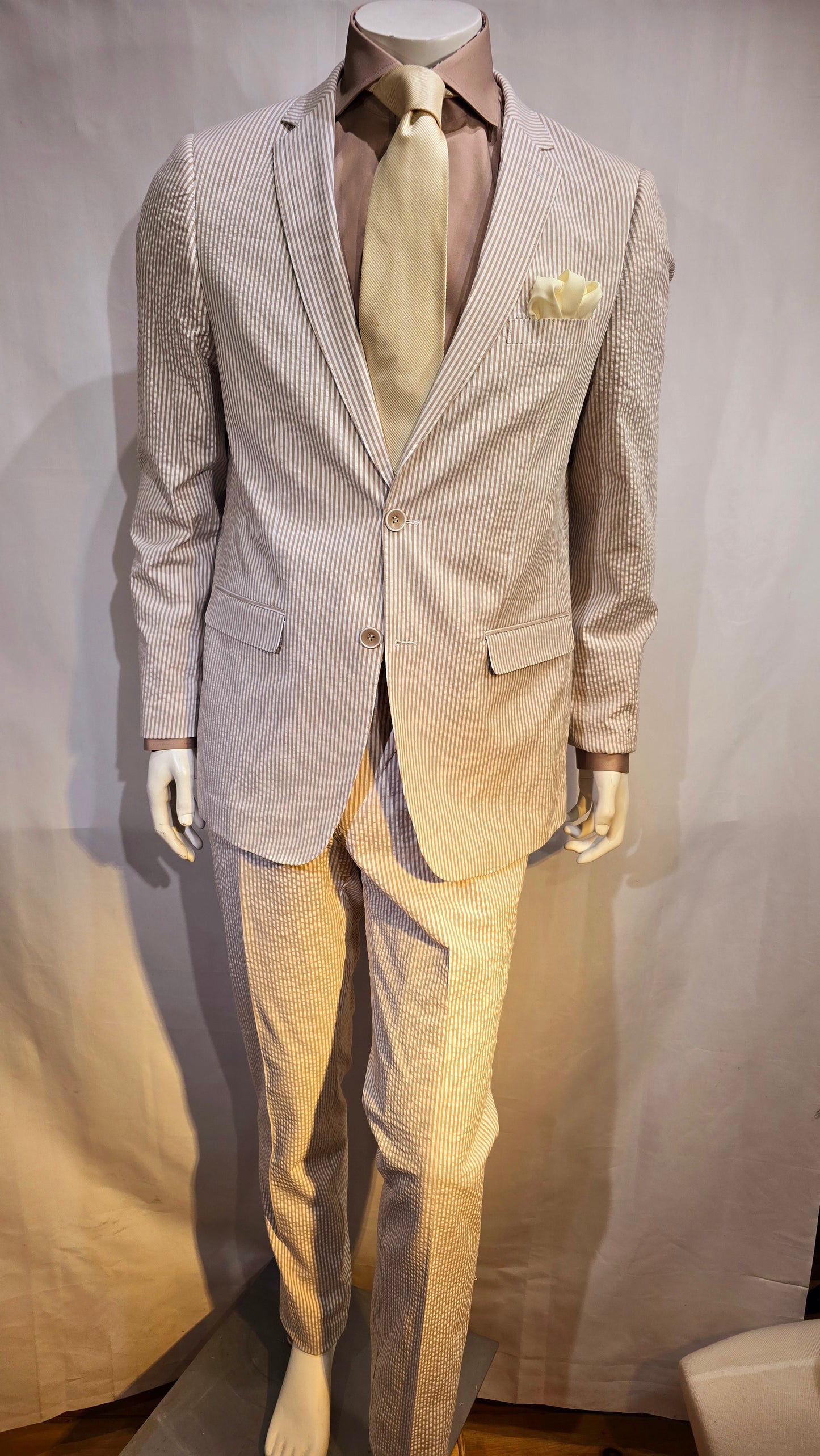 Summer ready. Fashionable, comfortable classic 2 button seersucker suit. Available in Banana yellow, soft pink, classic blue & classic Tan. Great for Summer weddings, outdoor events and summer cruises.