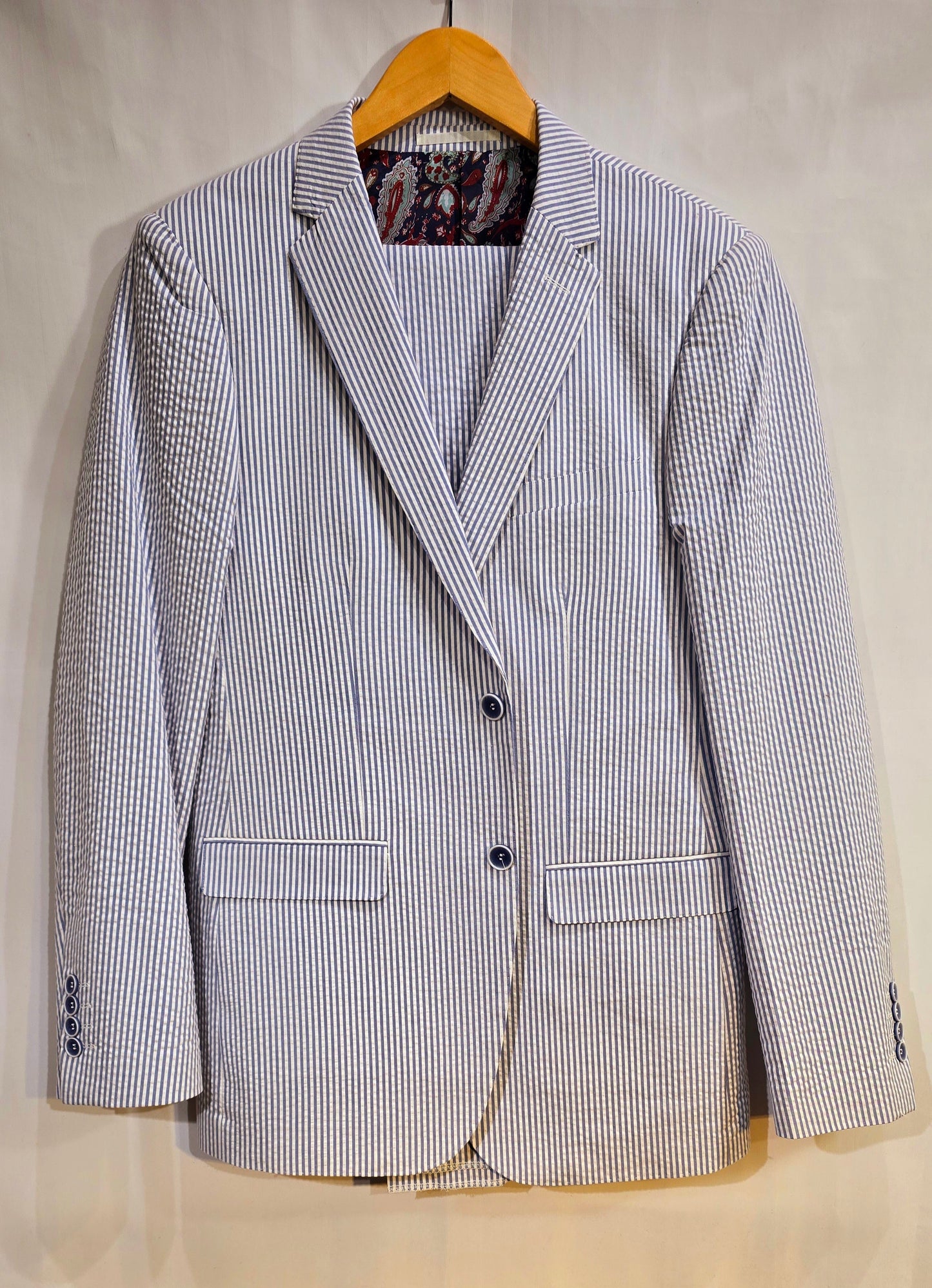 Summer ready. Fashionable, comfortable classic 2 button seersucker suit. Available in Banana yellow, soft pink, classic blue & classic Tan. Great for Summer weddings, outdoor events and summer cruises.