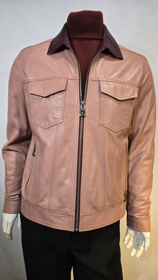 Fine lambskin leather with contrasting collar. Salmon color with 2 front chest snap pockets.