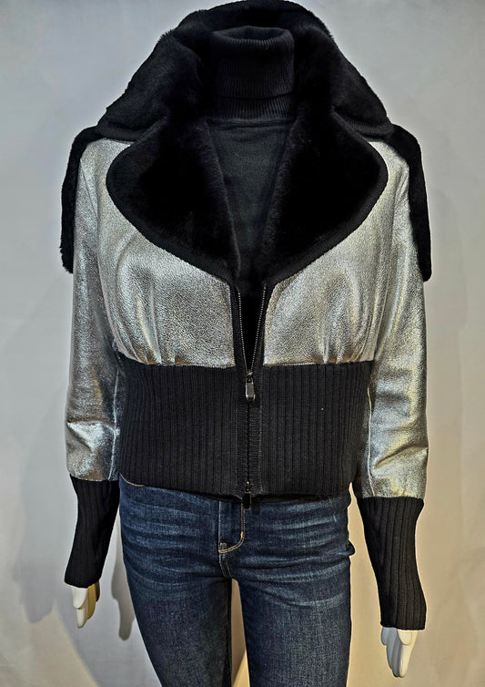 Silver metallic leather jacket with black shearling collar and trim.